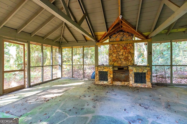 unfurnished sunroom featuring wood ceiling and vaulted ceiling with beams