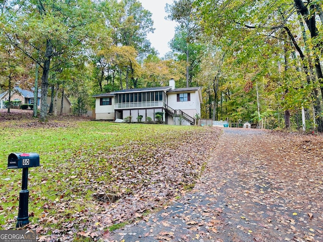 view of front of property with a sunroom