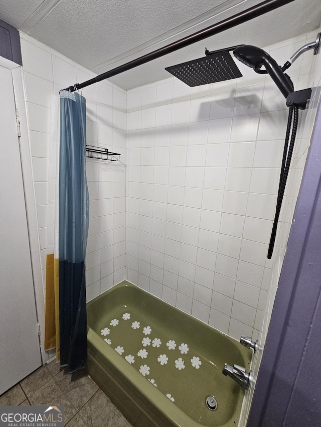 bathroom with tile patterned floors, curtained shower, and a textured ceiling