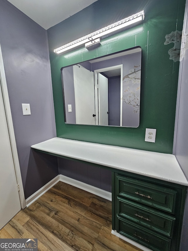 bathroom with hardwood / wood-style flooring