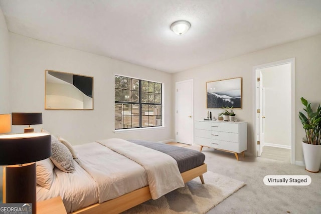 bedroom with light colored carpet