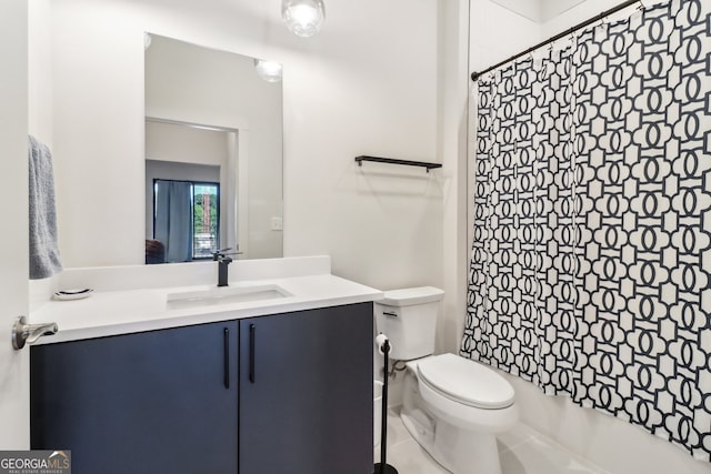 bathroom with toilet, vanity, tile patterned floors, and curtained shower