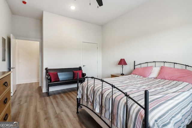 bedroom featuring light wood-type flooring and ceiling fan