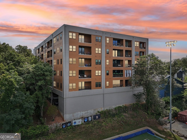 view of outdoor building at dusk