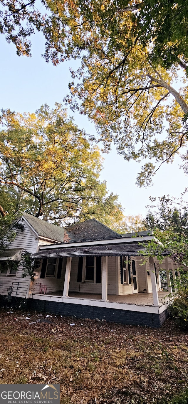 rear view of house with a porch