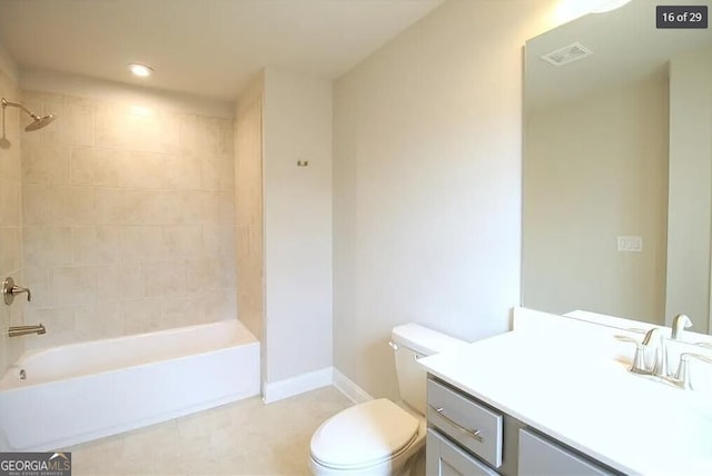 full bathroom with vanity, toilet, and tiled shower / bath