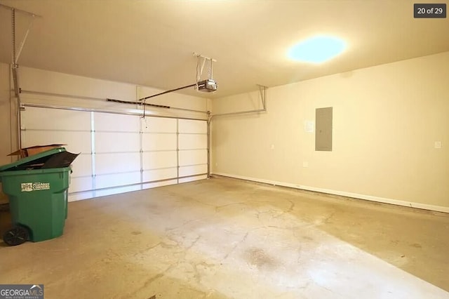 garage with electric panel and a garage door opener