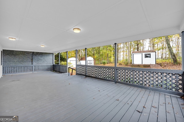 wooden deck with a shed