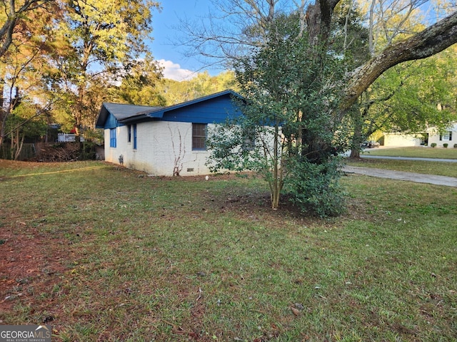 view of home's exterior featuring a lawn