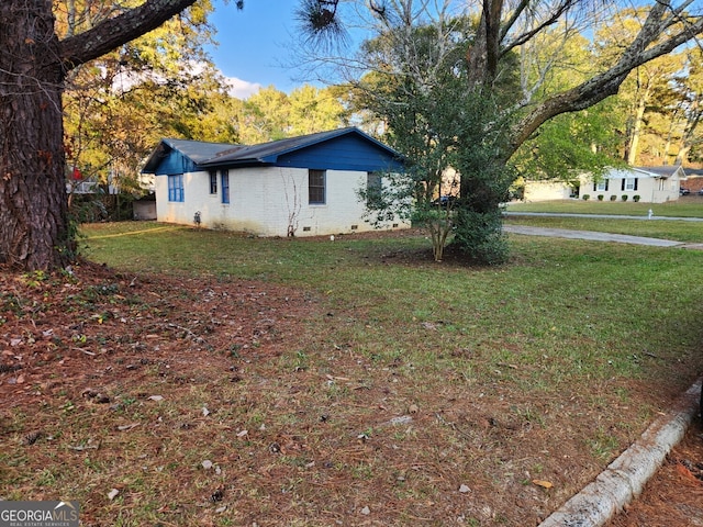 view of home's exterior featuring a yard