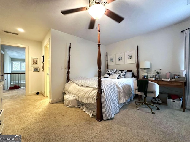 bedroom featuring light colored carpet and ceiling fan