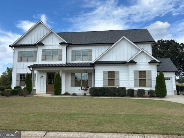 view of front of house featuring a front yard and a garage