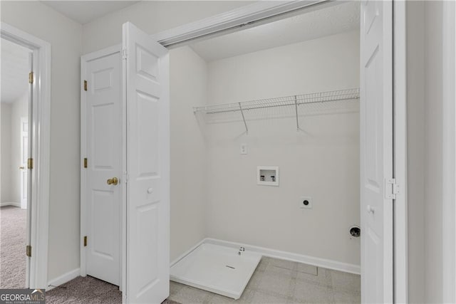 clothes washing area featuring light carpet, washer hookup, baseboards, hookup for an electric dryer, and laundry area