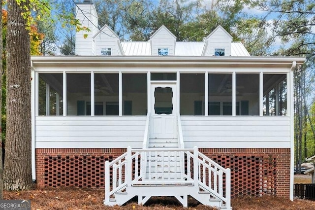 view of front facade featuring a sunroom