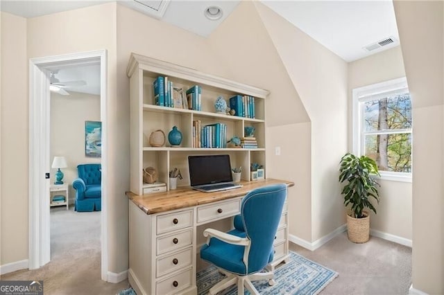 office space featuring light colored carpet and ceiling fan