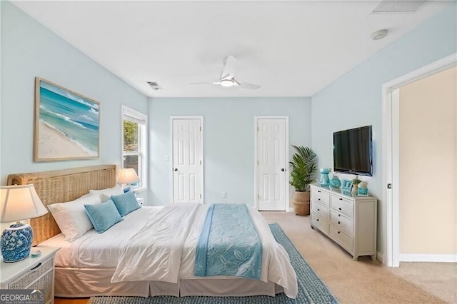 carpeted bedroom featuring ceiling fan