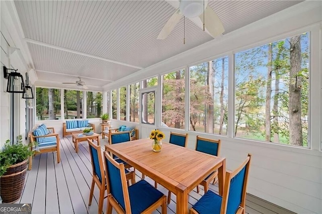 sunroom / solarium with a wealth of natural light and ceiling fan