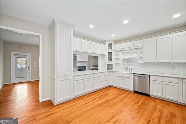 5500 Mccoy Rd Unit 15, Acworth, GA 30101 - kitchen featuring stainless steel dishwasher, light countertops, white cabinetry, light wood-style floors, and recessed lighting