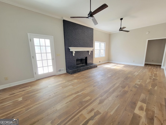 275 Allie Dr, Mcdonough, GA 30252 - unfurnished living room with ornamental molding, ceiling fan, light wood-type flooring, and baseboards