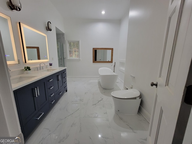 275 Allie Dr, Mcdonough, GA 30252 - full bathroom with baseboards, a freestanding tub, marble finish floors, double vanity, and recessed lighting