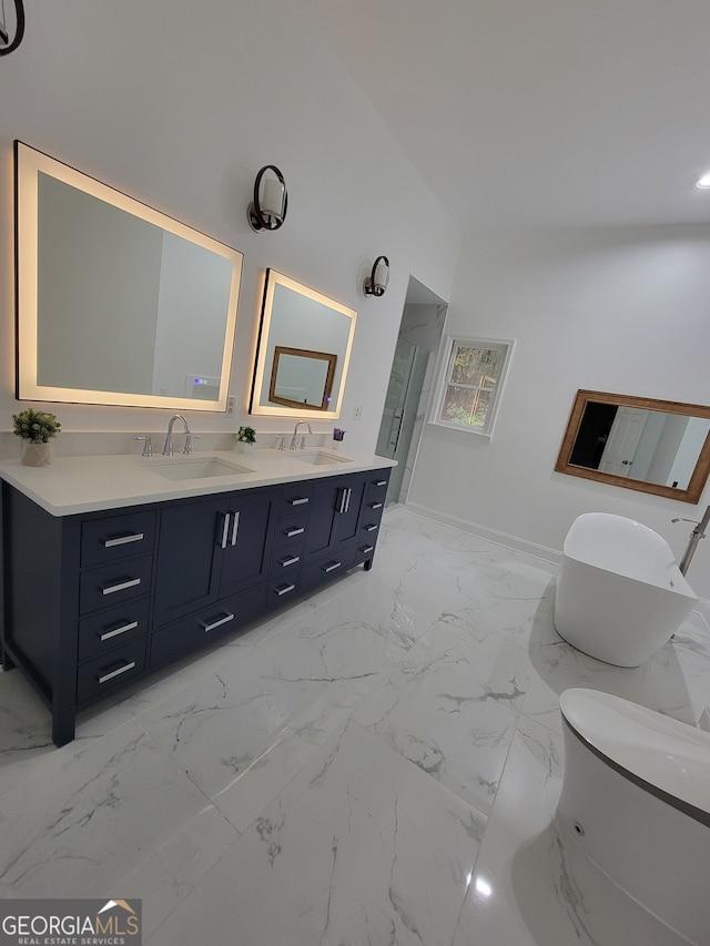 bathroom with vanity and a washtub