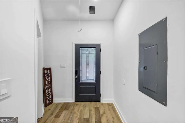 entryway featuring electric panel and light hardwood / wood-style flooring