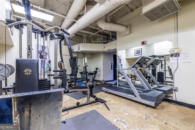 workout area featuring concrete floors