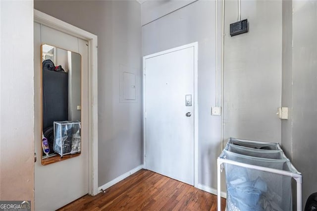 doorway with dark wood-type flooring