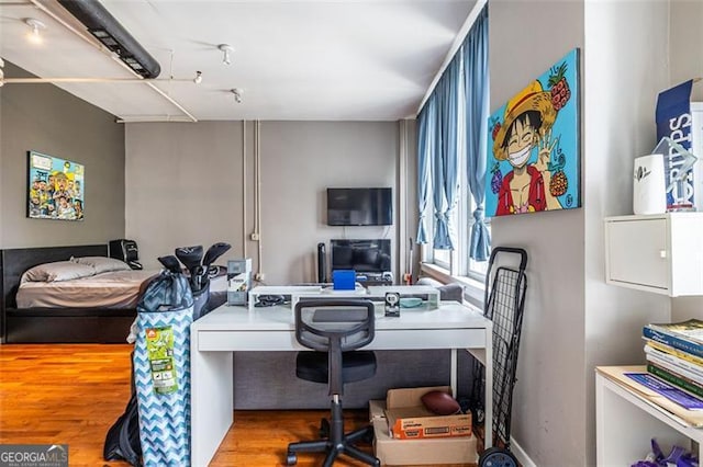 home office featuring hardwood / wood-style flooring