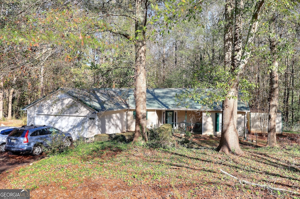 single story home featuring covered porch