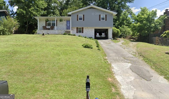 tri-level home featuring a carport, a porch, and a front yard