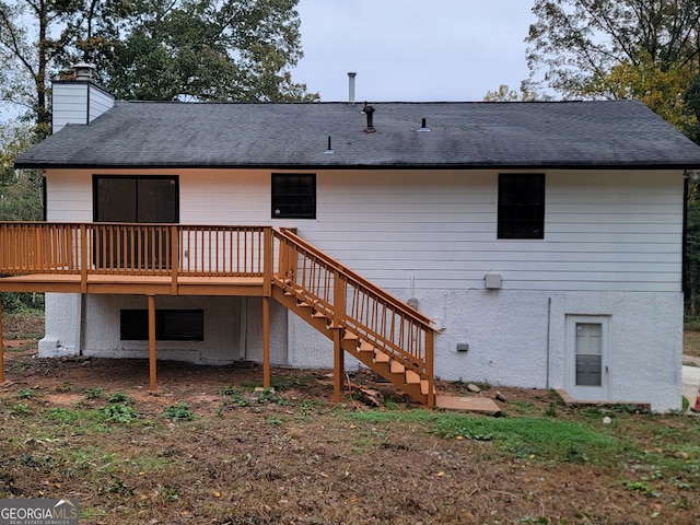 rear view of house featuring a deck