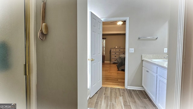 bathroom featuring vanity, walk in shower, and hardwood / wood-style flooring