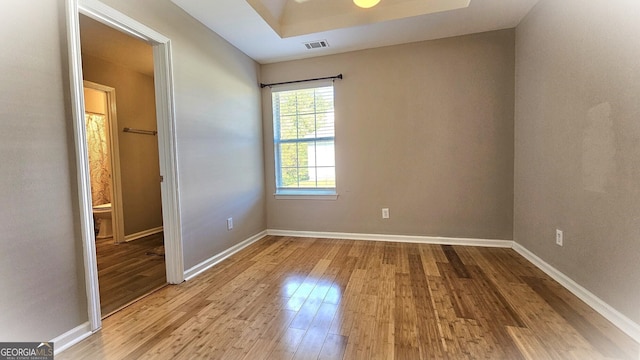 empty room with light hardwood / wood-style flooring