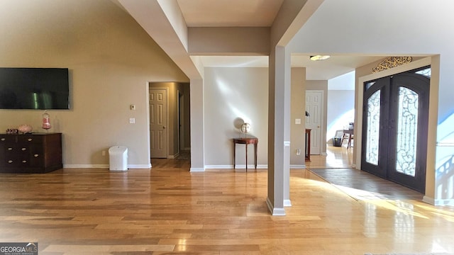 entrance foyer featuring french doors and light hardwood / wood-style floors