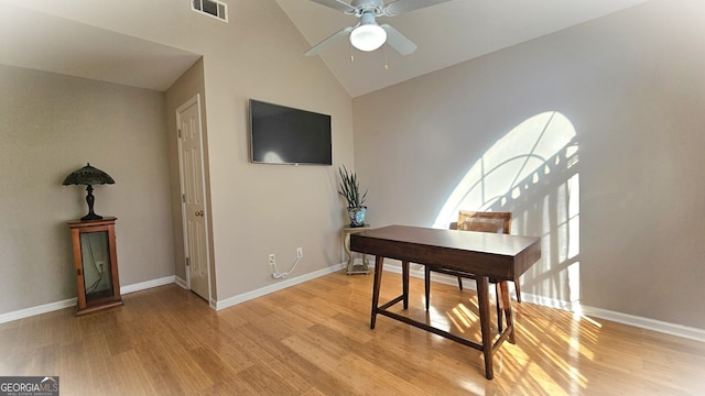 office area featuring high vaulted ceiling, ceiling fan, and light wood-type flooring