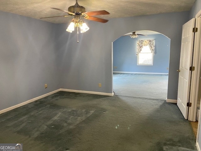 unfurnished room featuring ceiling fan, a textured ceiling, and carpet floors