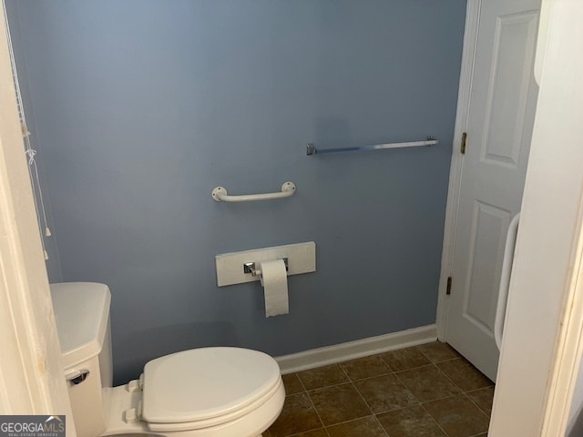 bathroom featuring tile patterned flooring and toilet