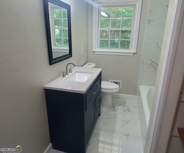 bathroom with vanity and toilet