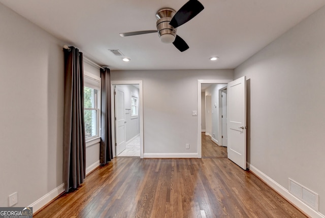 unfurnished bedroom featuring ceiling fan and wood-type flooring