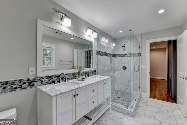 bathroom with vanity, hardwood / wood-style flooring, and a shower with shower door