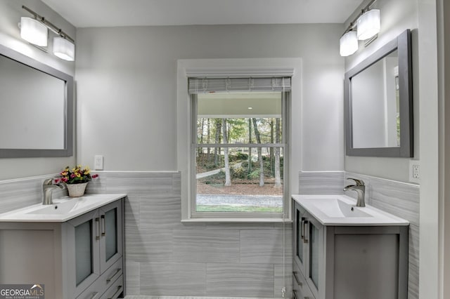 bathroom with tile walls and vanity