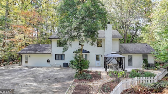 back of house featuring a patio area and a gazebo