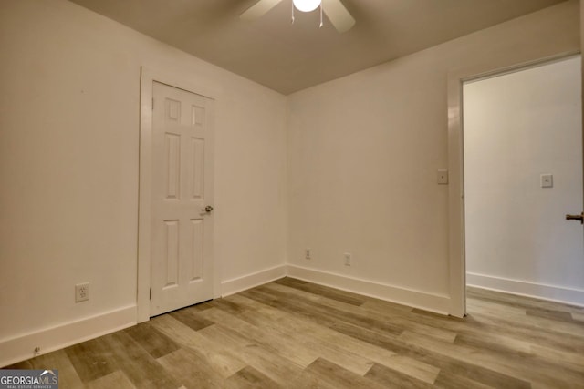 spare room with ceiling fan and light hardwood / wood-style floors