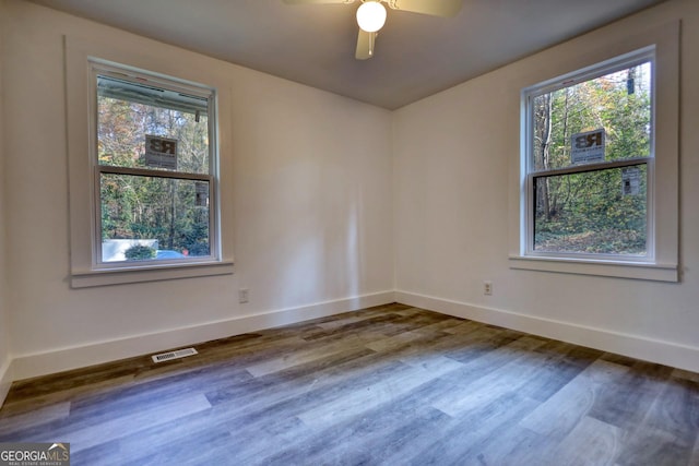 empty room featuring hardwood / wood-style floors and ceiling fan