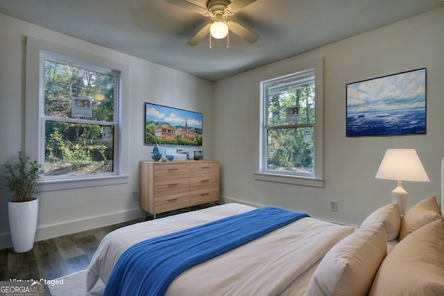 bedroom featuring ceiling fan and dark hardwood / wood-style floors