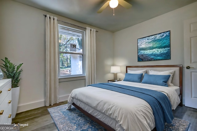 bedroom with ceiling fan and hardwood / wood-style floors