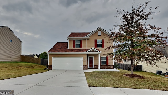 craftsman inspired home with a garage and a front lawn