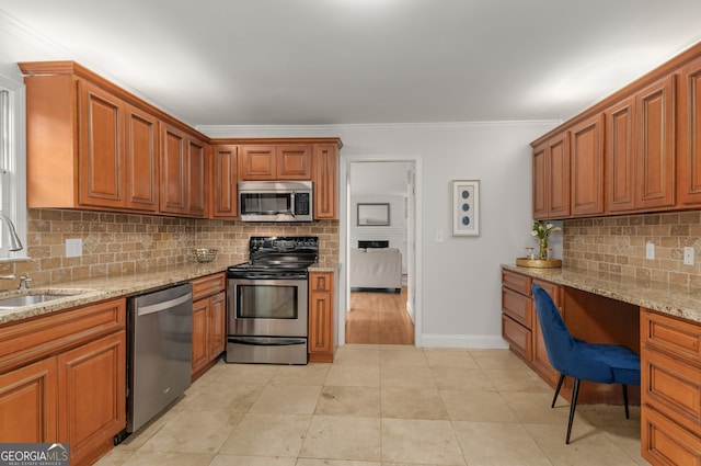 kitchen with backsplash, crown molding, sink, light stone countertops, and stainless steel appliances