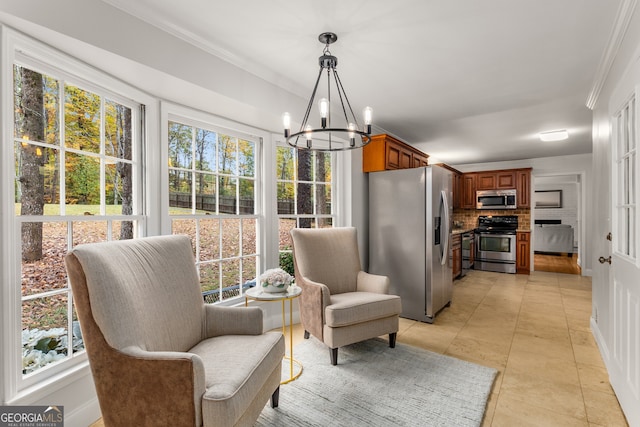 living area featuring light tile patterned flooring, an inviting chandelier, a healthy amount of sunlight, and crown molding